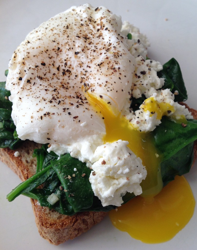 poached egg on toast with wilted spinach