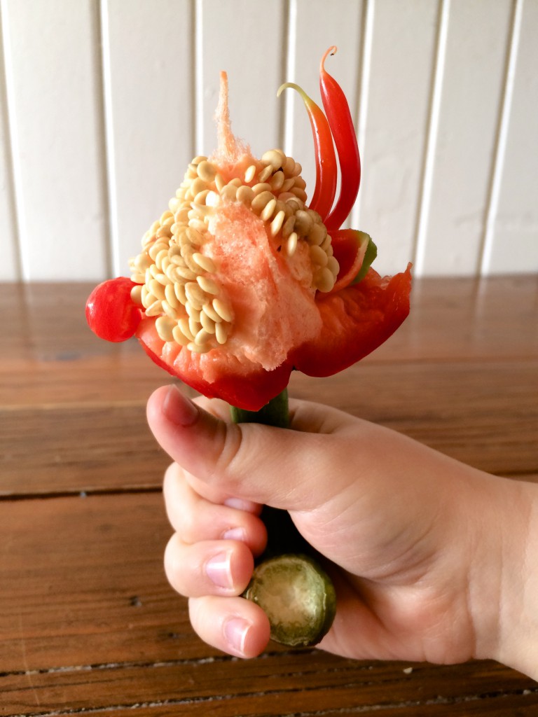 hand holding red pepper core